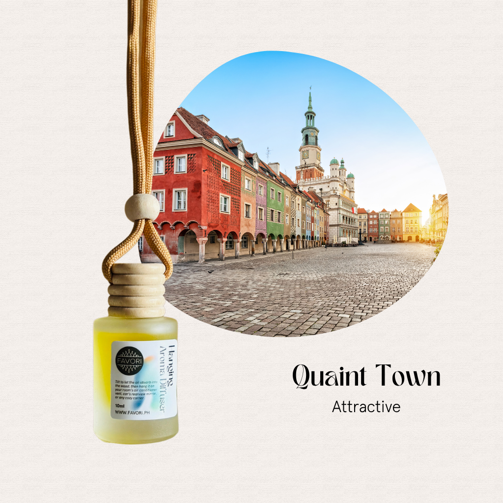 A FAVORI Scents Hanging Aroma Diffuser bottle with a colorful European town square in the background.