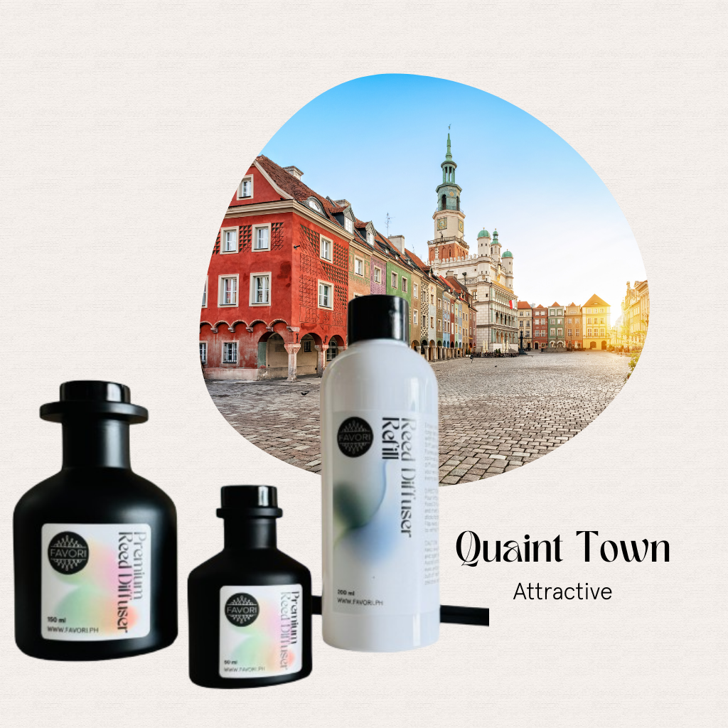 Three Quaint Town Trio Premium Reed Diffusers by FAVORI Scents set before a colorful European town square.