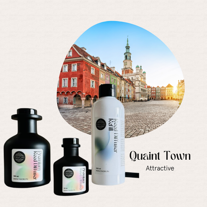 Three Quaint Town Trio Premium Reed Diffusers by FAVORI Scents set before a colorful European town square.