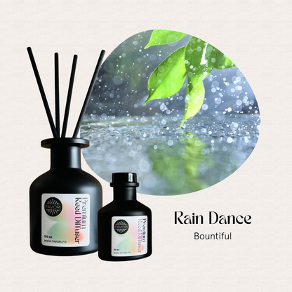 Two black FAVORI Rain Dance Premium Reed Diffusers beside a green leaf circle, labeled Bountiful aroma.