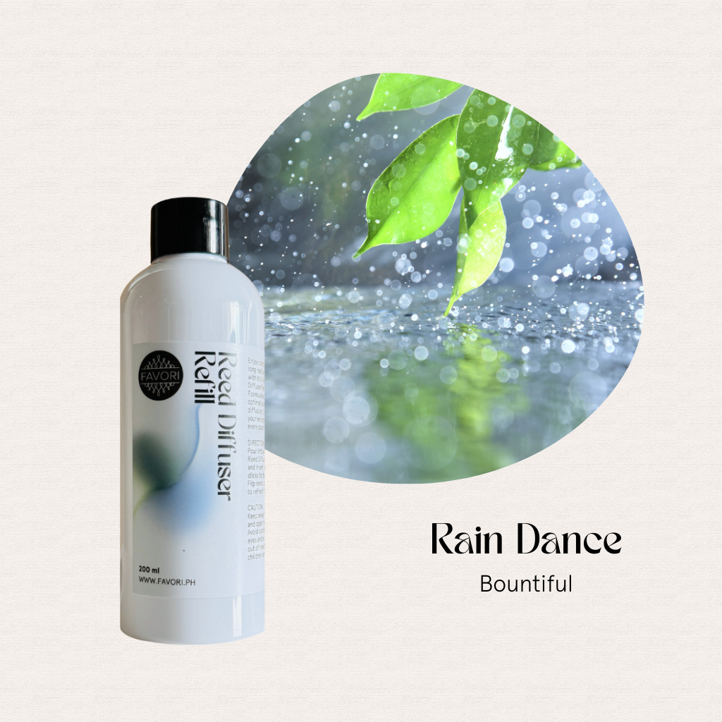 FAVORI Scents Rain Dance Reed Diffuser Refill (RDR) with fiber sticks, leaves, and raindrops in the background.