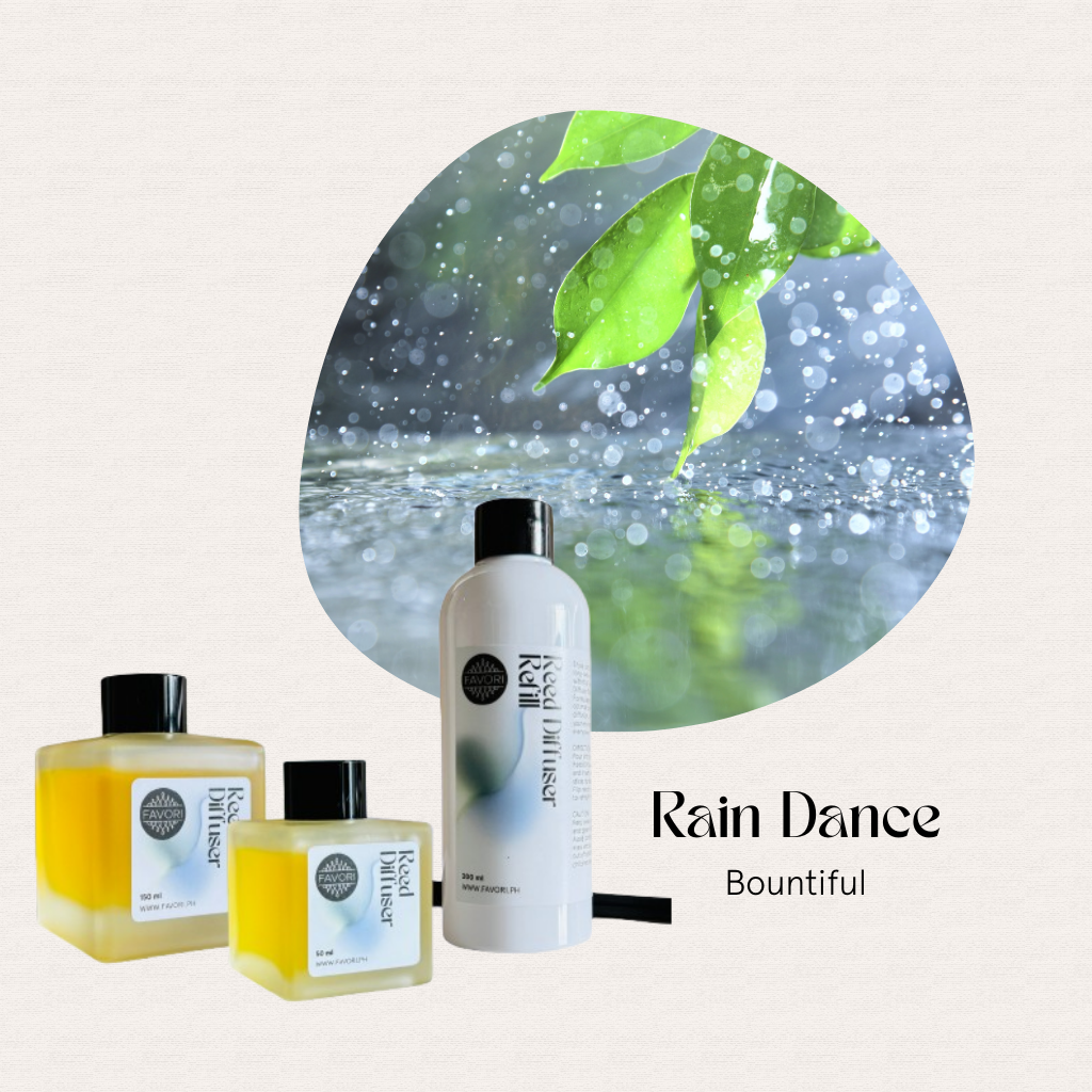 Three FAVORI Scents Rain Dance Trio Reed Diffusers beside a dewy leaf, radiating the Rain Dance aroma.