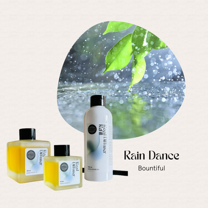 Three FAVORI Scents Rain Dance Trio Reed Diffusers beside a dewy leaf, radiating the Rain Dance aroma.