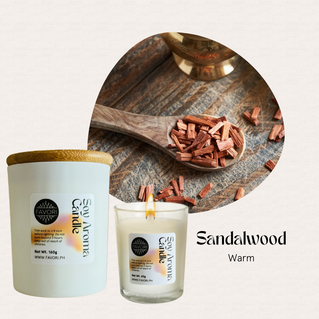 FAVORI Scents All Occasion soy candle, burning and unlit, with sandalwood chips on a spoon in back.