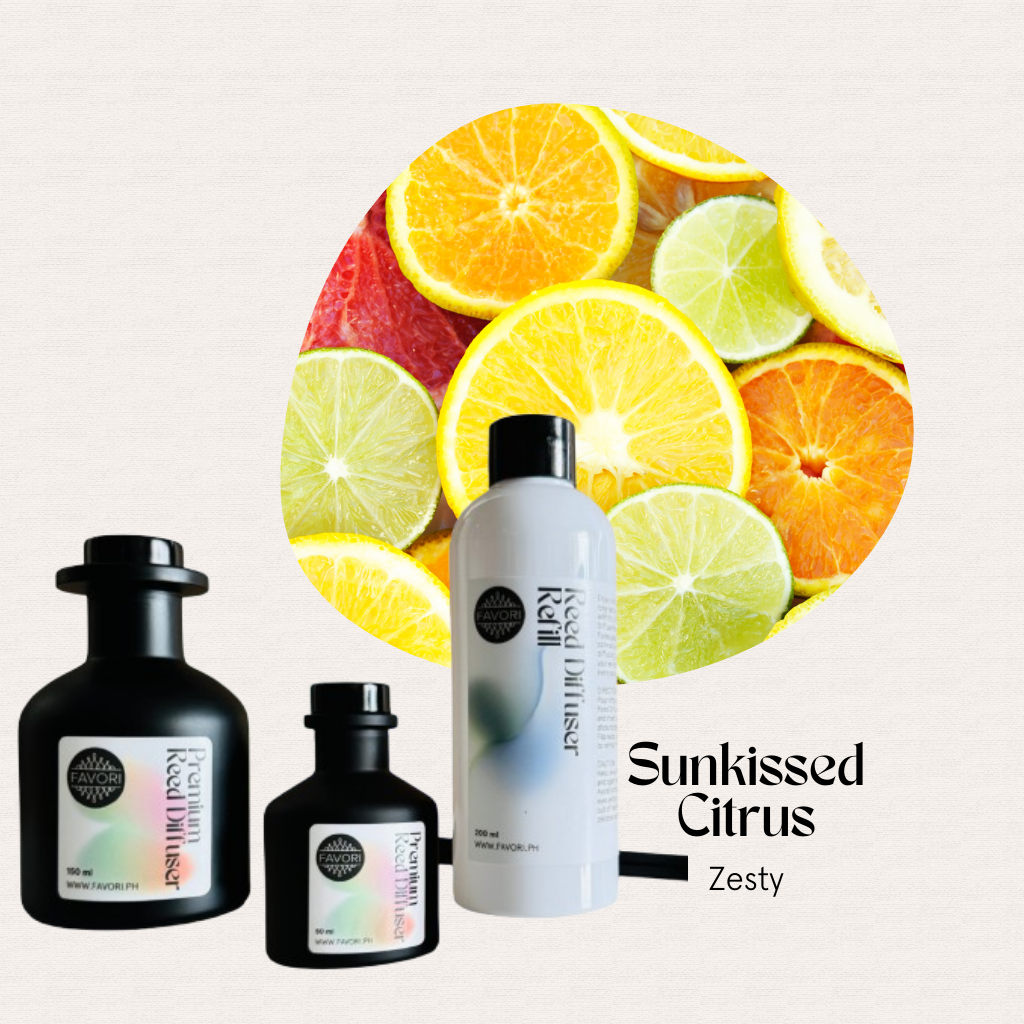 Assorted citrus slices behind three FAVORI Scents Sunkissed Citrus Trio Premium Reed Diffuser bottles.