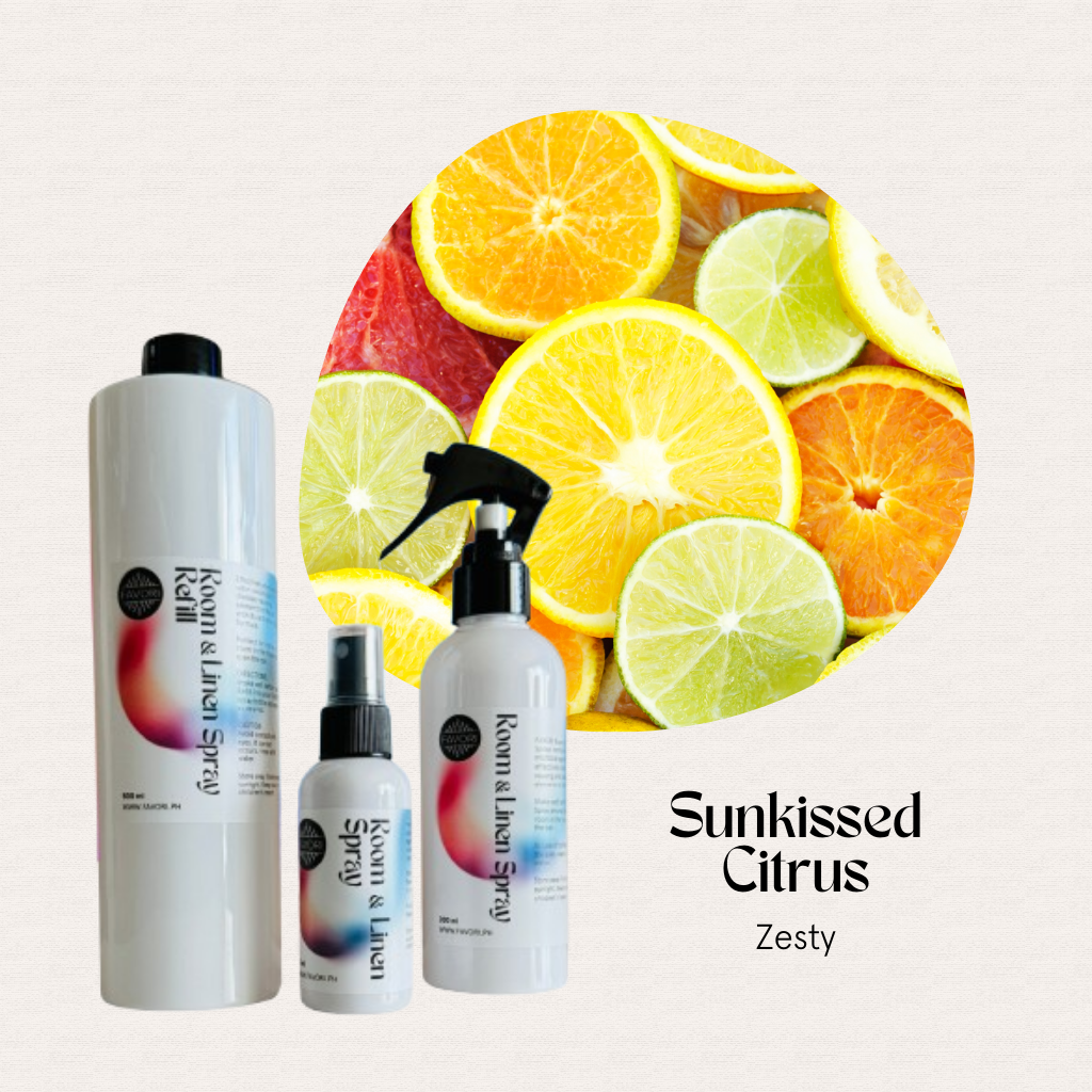 Three FAVORI Scents Trio Air Sprays, citrus-scented, are displayed with sliced lemons, limes, and oranges.