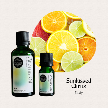 Two FAVORI Scents Burner Aroma Oils in Sunkissed Citrus - Zesty beside sliced citrus.