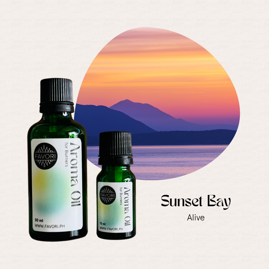 Two bottles of FAVORI Scents Burner Aroma Oils with a sunset bay, mountains, and calm water in the background.