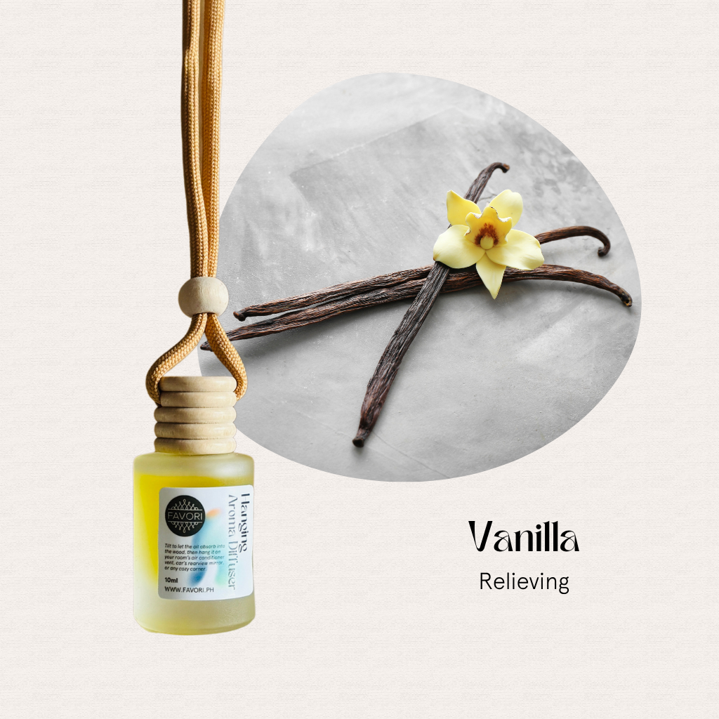 FAVORI Scents Hanging Aroma Diffusers (HAD) in vanilla beside vanilla beans and a yellow vanilla flower.