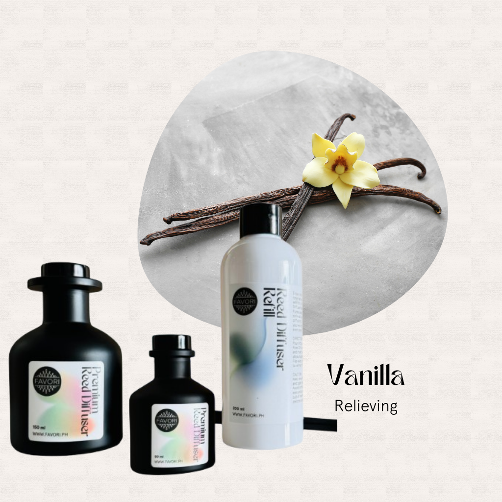 FAVORI Scents Vanilla Trio Premium Reed Diffuser set before vanilla pods and a blooming flower.