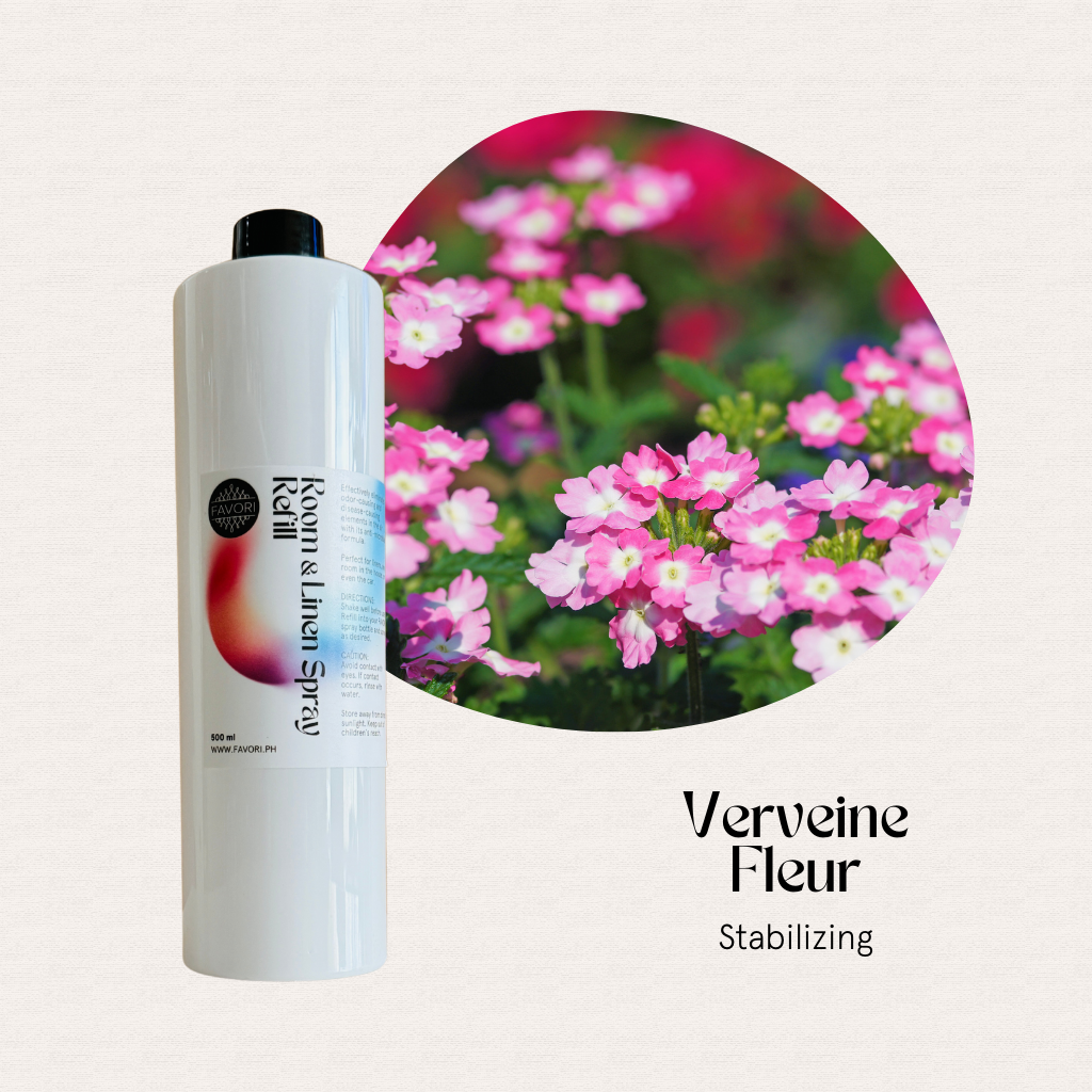 White bottle of FAVORI Scents Refill – Regular Room & Linen Air Spray (AS) 500ml beside pink verbena.