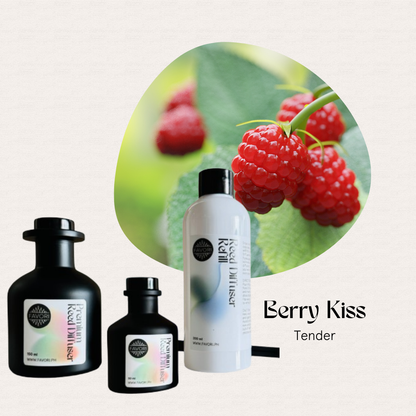 FAVORI Scents Berry Kiss Trio Premium Reed Diffuser bottles set before ripe red raspberries.