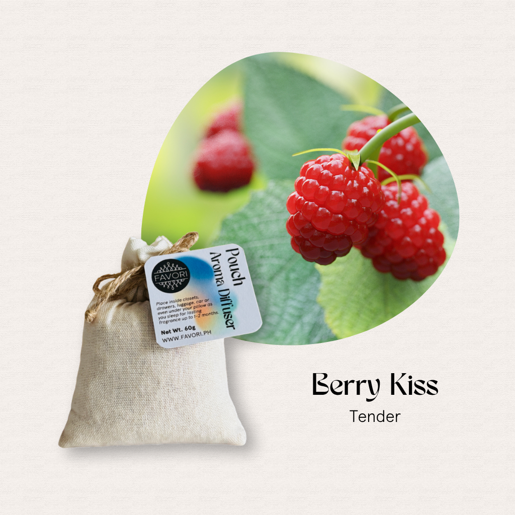 Close-up of ripe raspberries above a pouch with FAVORI Scents PAD: Berry Kiss Tender aroma diffuser oil.
