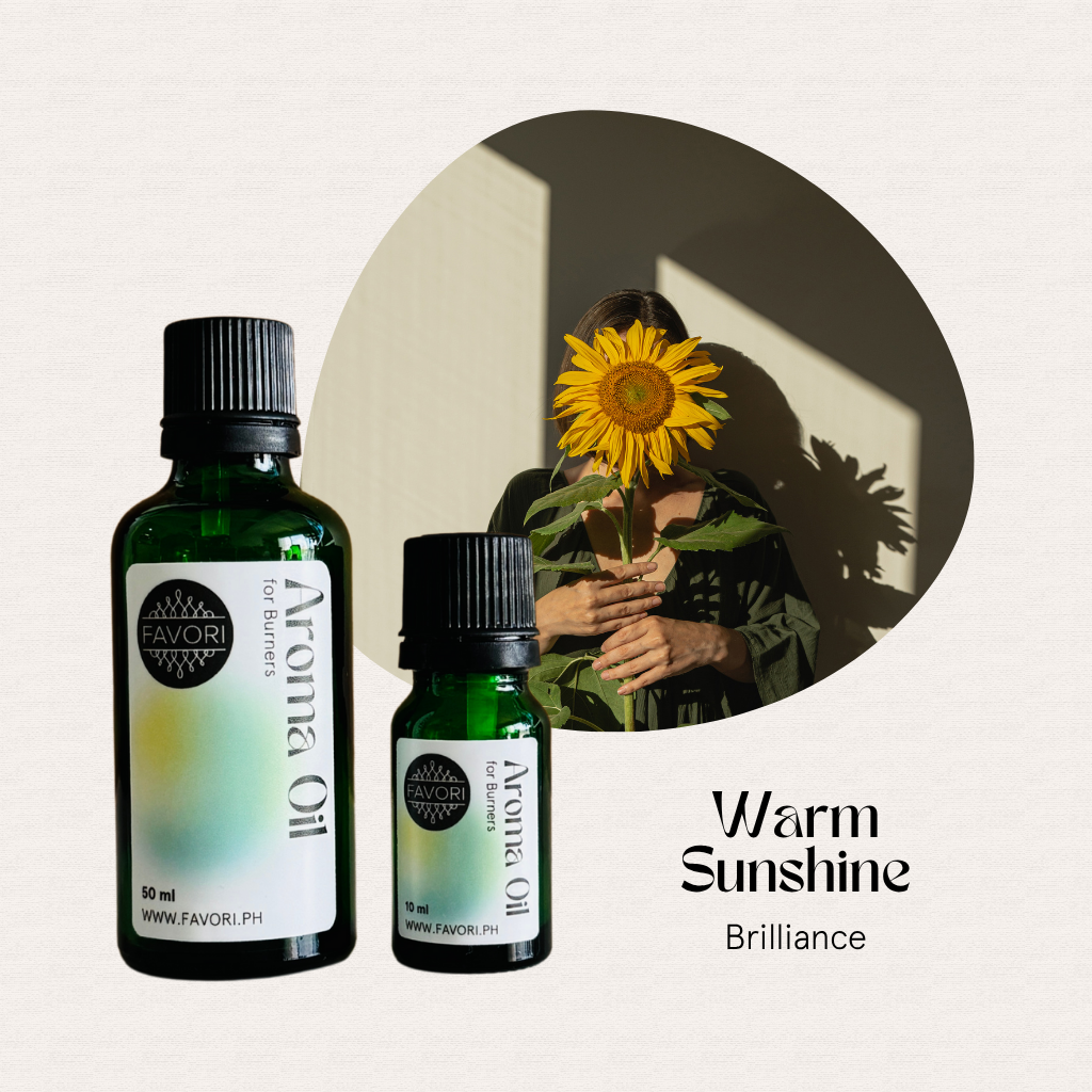 Two FAVORI Scents Burner Aroma Oils in front of a photo of someone holding a sunflower to their face.