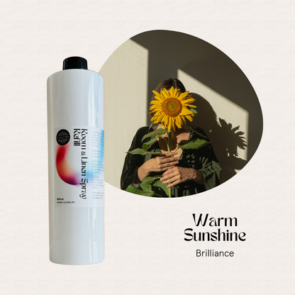 A spray bottle and a person holding a sunflower, featuring text: FAVORI Scents Refill Room & Linen Air Spray 500ml.