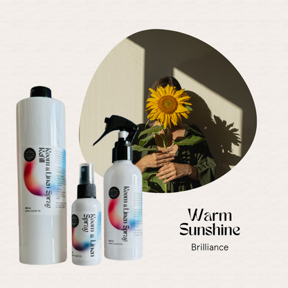 Three air spray bottles and a person with a sunflower in sunlight. Text: FAVORI Scents Trio Regular Room & Linen AS.
