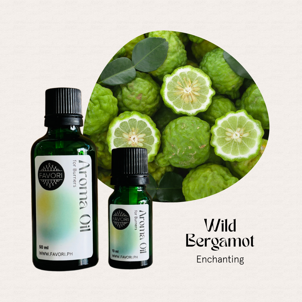 Two bottles of FAVORI Scents Burner Aroma Oils labeled Wild Bergamot beside bergamot fruits.