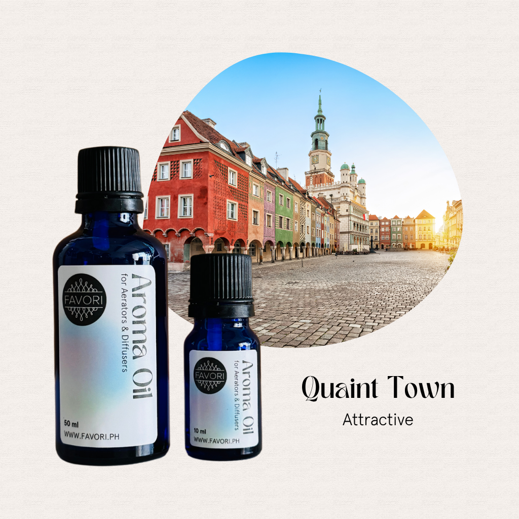 Two FAVORI Scents AD Aroma Oils bottles in blue, set before a vibrant European cobblestone town square.