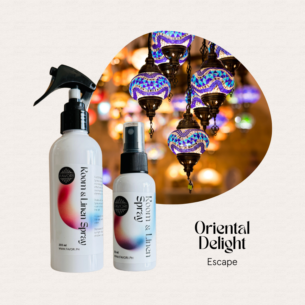 Two FAVORI Scents Regular Room & Linen Air Sprays are set before mosaic lanterns, ideal for enhancing mood.