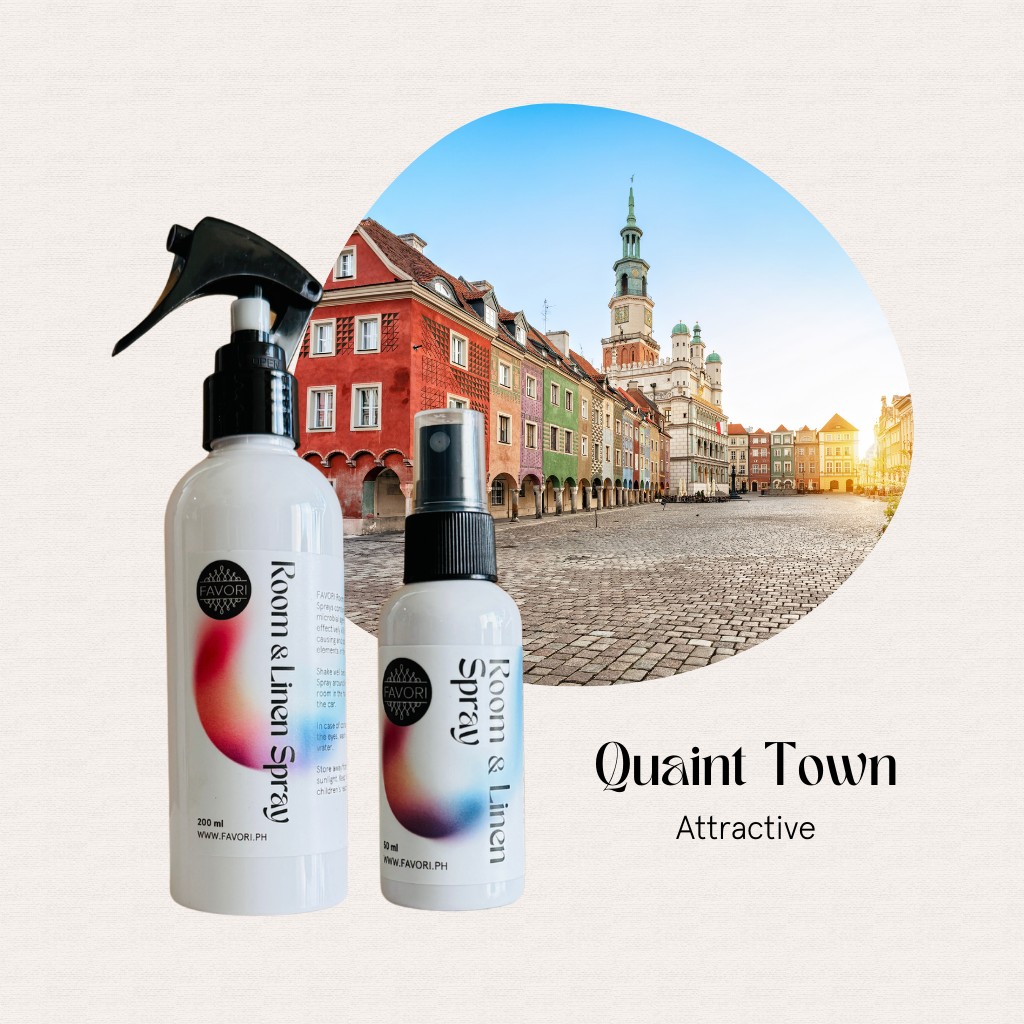 Two FAVORI Scents Regular Room & Linen Air Sprays stand ready to freshen the air in a lively European square.