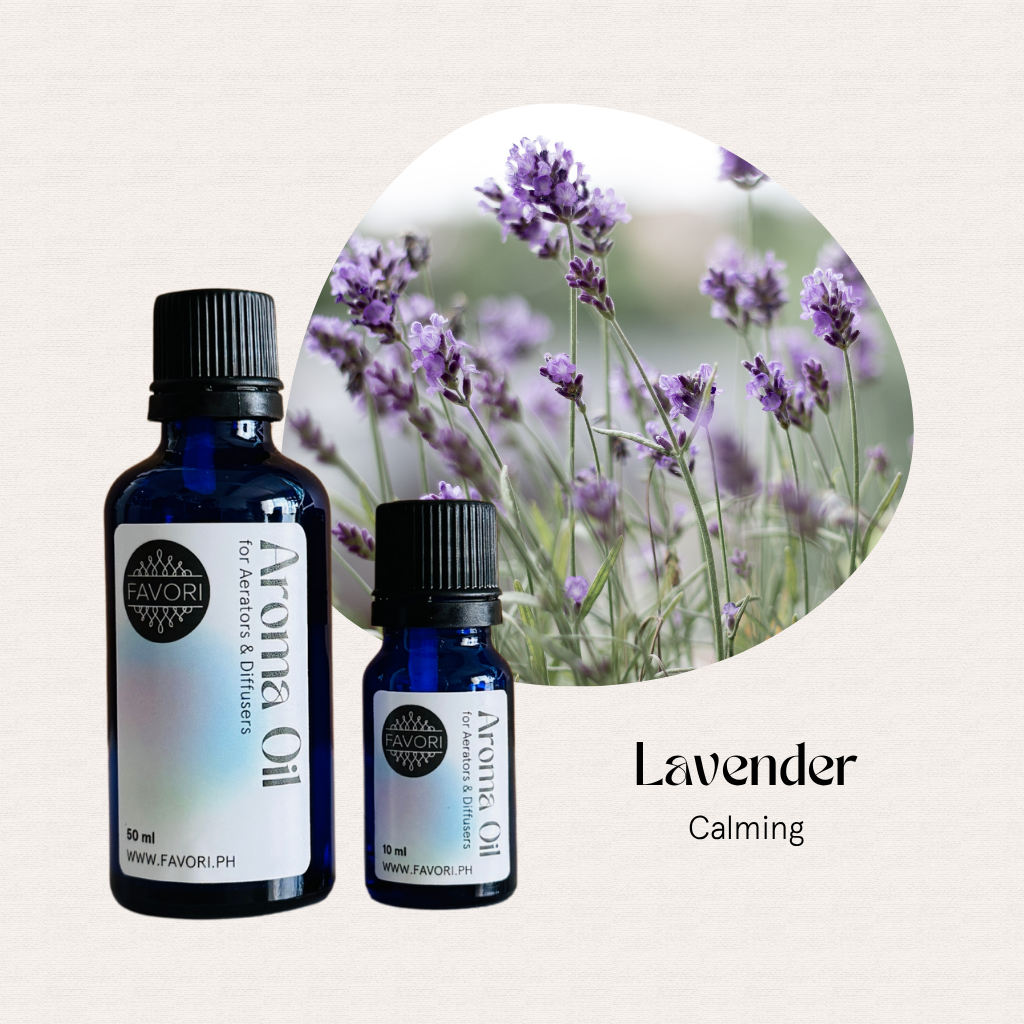 Two blue bottles of FAVORI Scents AD Aroma Oils in lavender scent, with Lavender Calming in the background.
