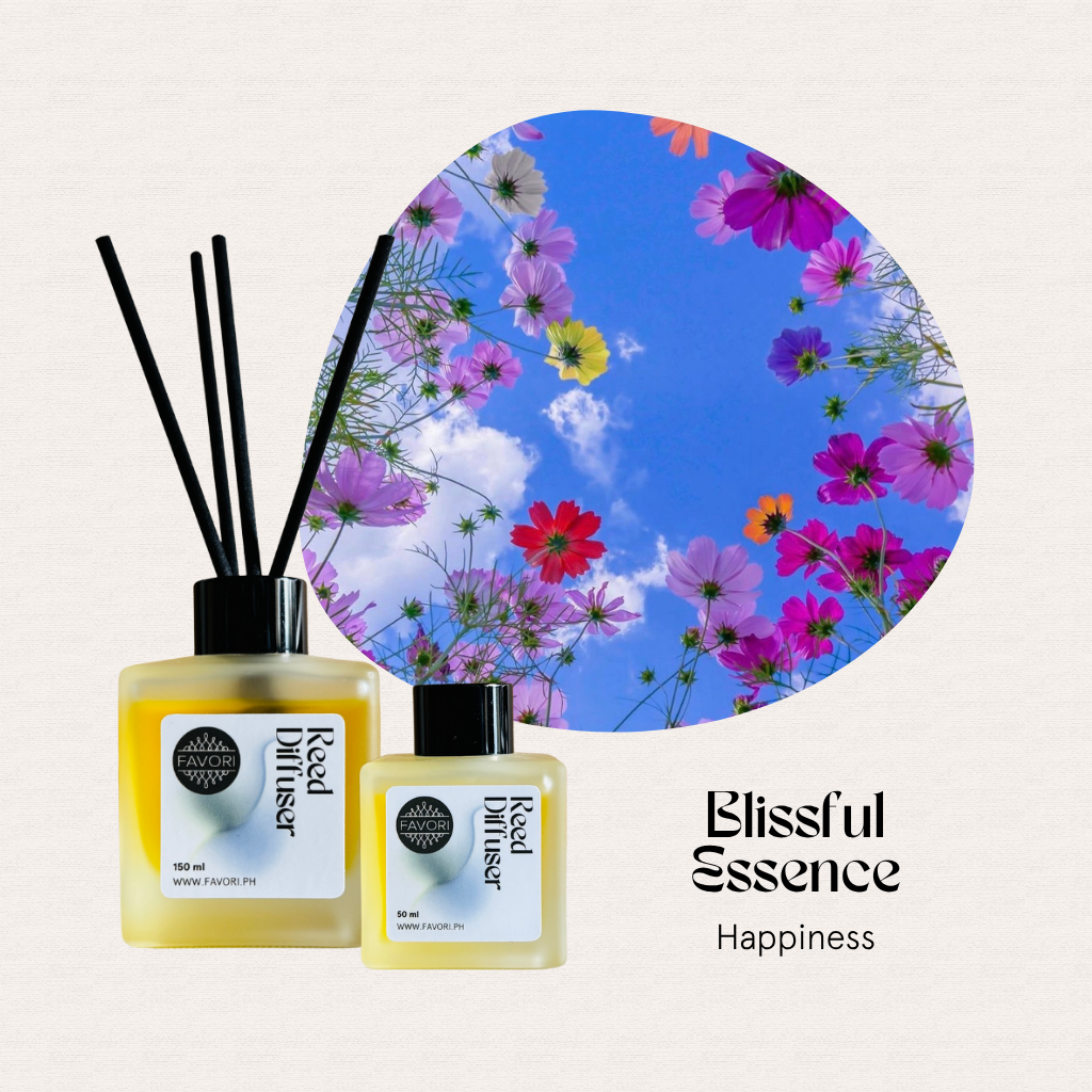 Two FAVORI Scents Blissful Essence RRDs add hotel scent beside pink, purple, and white flowers under a blue sky.