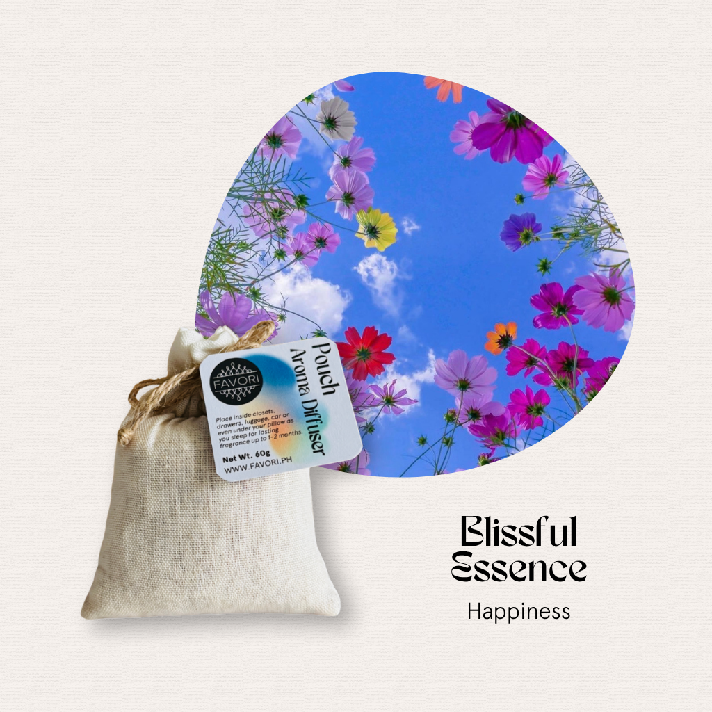 A FAVORI Scents Pouch Aroma Diffuser sits by a heart-shaped photo, with water-soluble Blissful Essence oil.