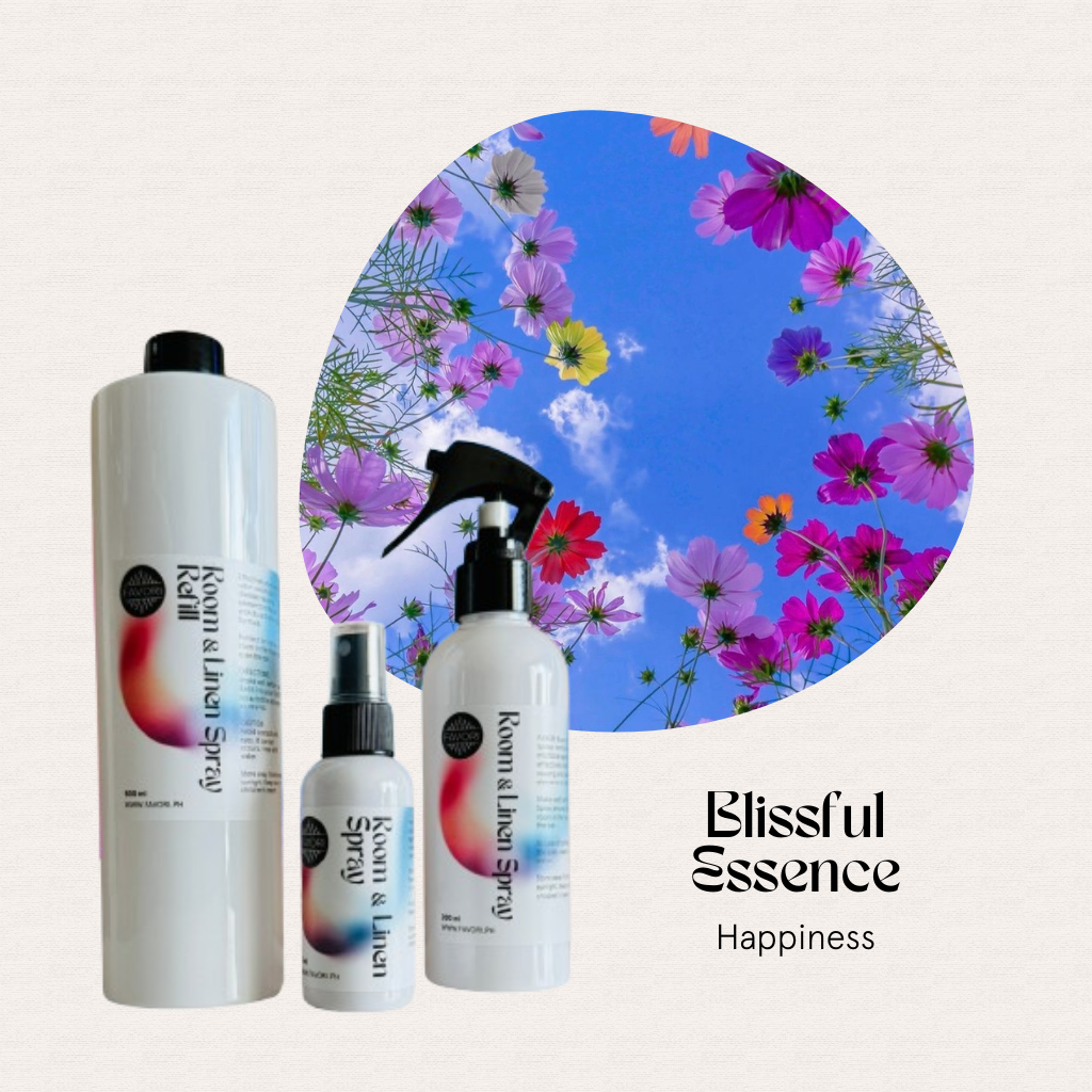 Three FAVORI Scents Trio Room & Linen Air Sprays in front of flowers and sky.