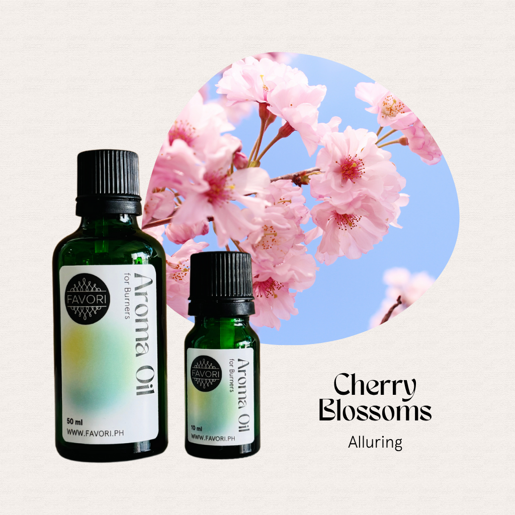 Two FAVORI Scents Burner Aroma Oils beside pink cherry blossoms, labeled Cherry Blossoms Alluring.