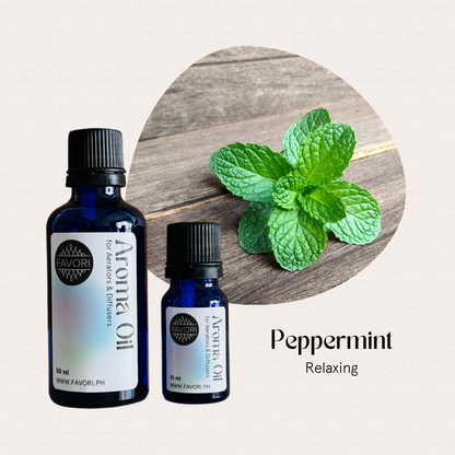 Two FAVORI Scents AD Aroma Oils sit by a peppermint sprig, labeled Peppermint Relaxing.
