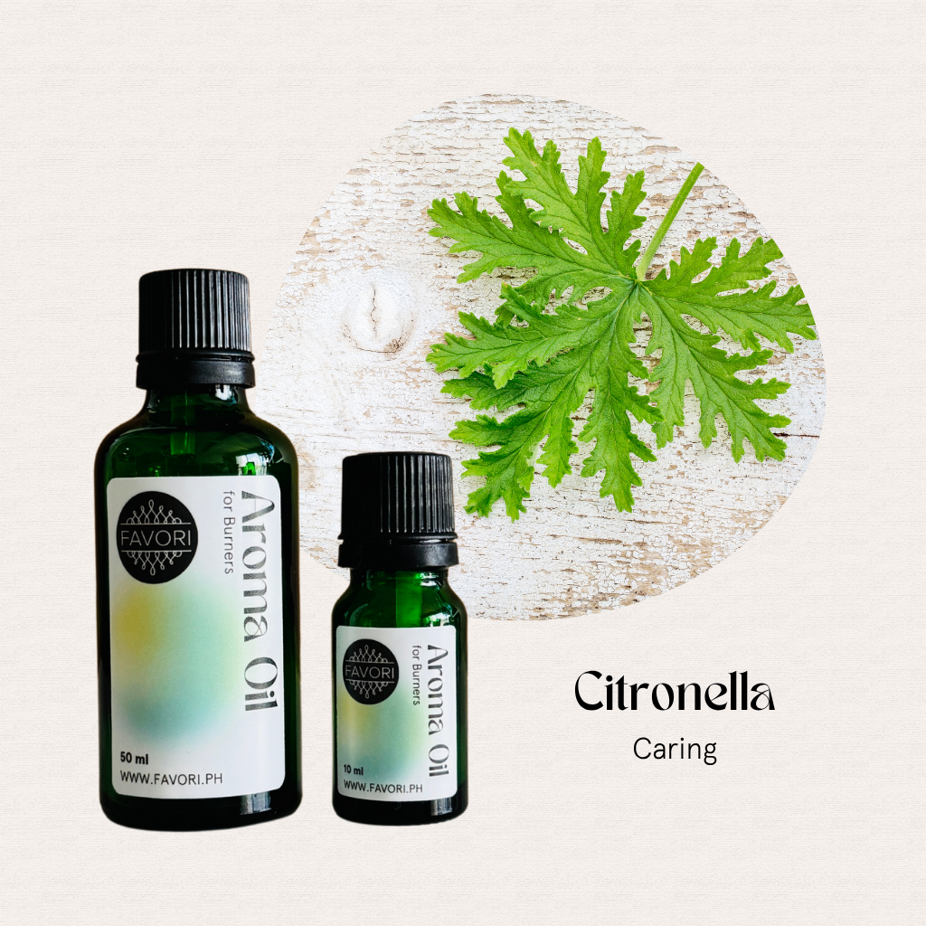 Two green FAVORI Scents Burner Aroma Oils beside a citronella leaf on a light background.