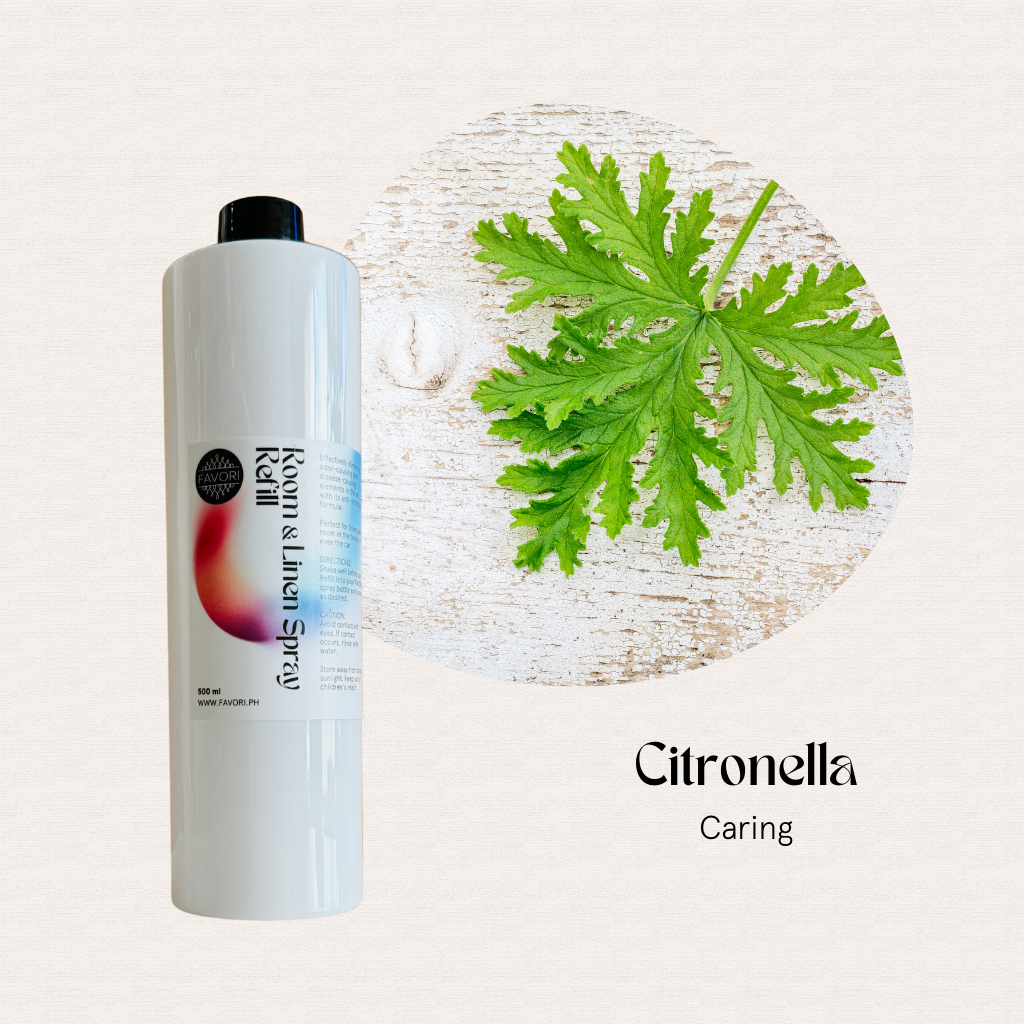 A white 500ml FAVORI Scents Air Spray sits beside a green citronella leaf on a light textured background.
