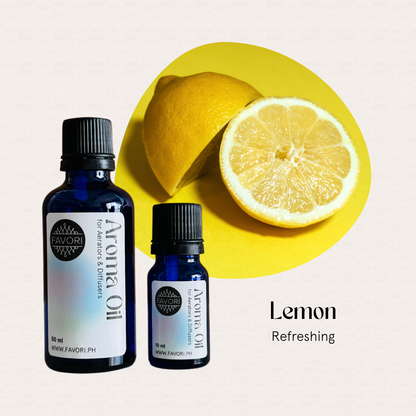 Two FAVORI Scents AD Aroma Oils, Lemon scent, for diffuser use, with a sliced lemon on yellow.