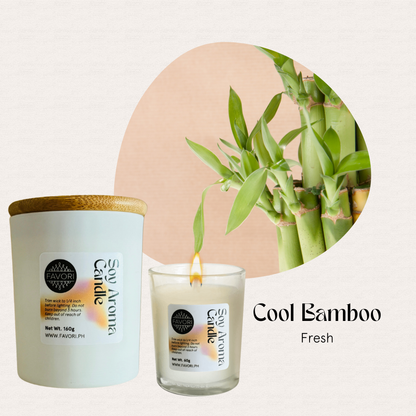 A lit FAVORI Scents All Occasion soy candle and jar, labeled Cool Bamboo Fresh, beside fresh bamboo.
