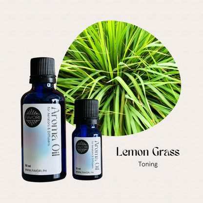 Two FAVORI Scents AD Aroma Oils bottles with long-lasting lemongrass scent before green lemongrass leaves.