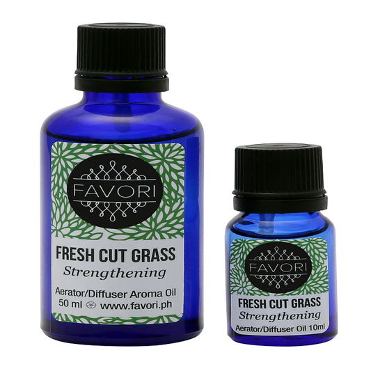 Two bottles of FAVORI Scents Fresh Cut Grass Aerator/Diffuser (AD) Aroma Oil in different sizes.