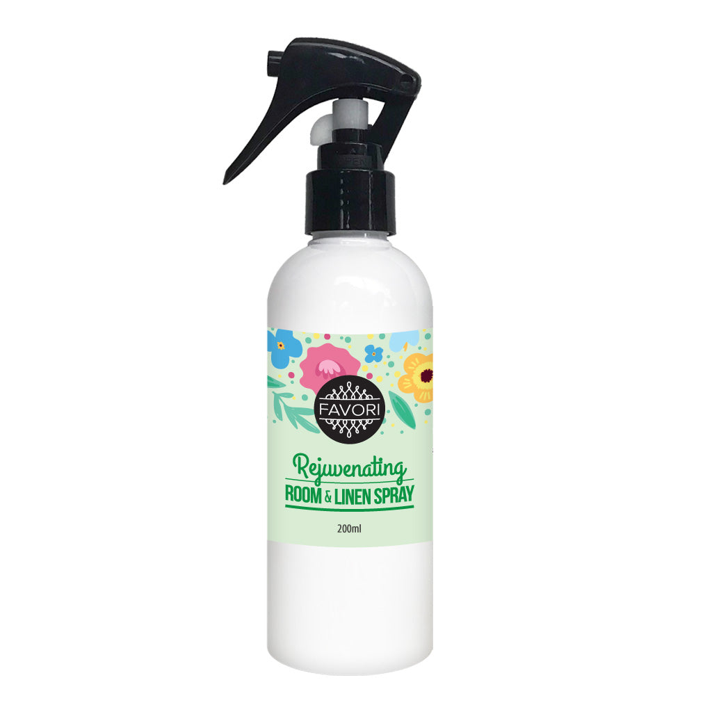 White spray bottle labeled "FAVORI Rejuvenating Room & Linen Air Spray" with floral graphic design, 200ml.
