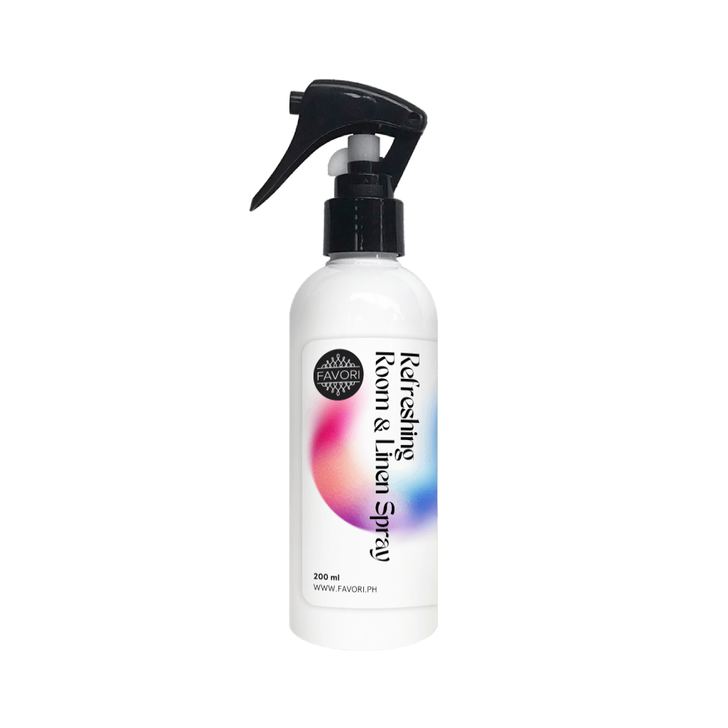 White FAVORI Scents Refreshing Room & Linen Air Spray (AS) with black nozzle on a plain background.