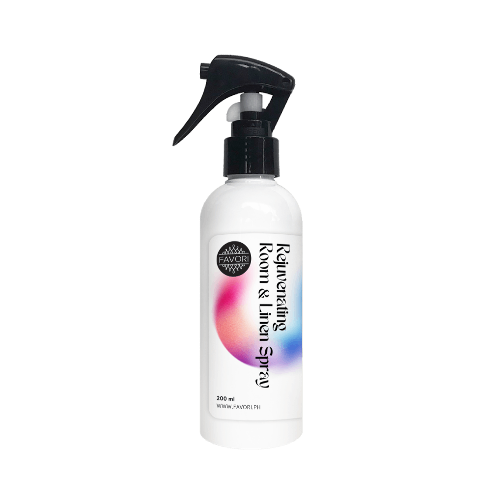 FAVORI Scents Rejuvenating Room & Linen Air Spray (AS) features a black nozzle and colorful gradient design.