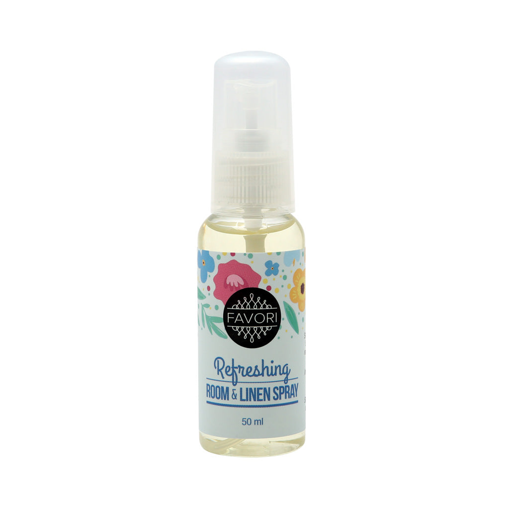 A 50 ml bottle of FAVORI Scents Refreshing Room & Linen Air Spray with a floral design on the label and oil essence.