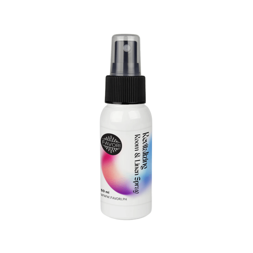 A white FAVORI Scents Revitalizing Room & Linen Air Spray (AS) bottle with black cap and gradient design.