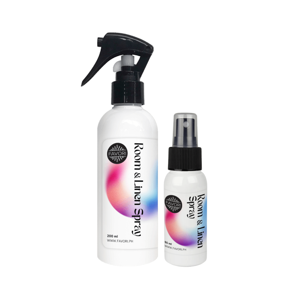 Two white FAVORI Scents RAS bottles with colorful abstract labels, labeled Room & Linen Air Spray.