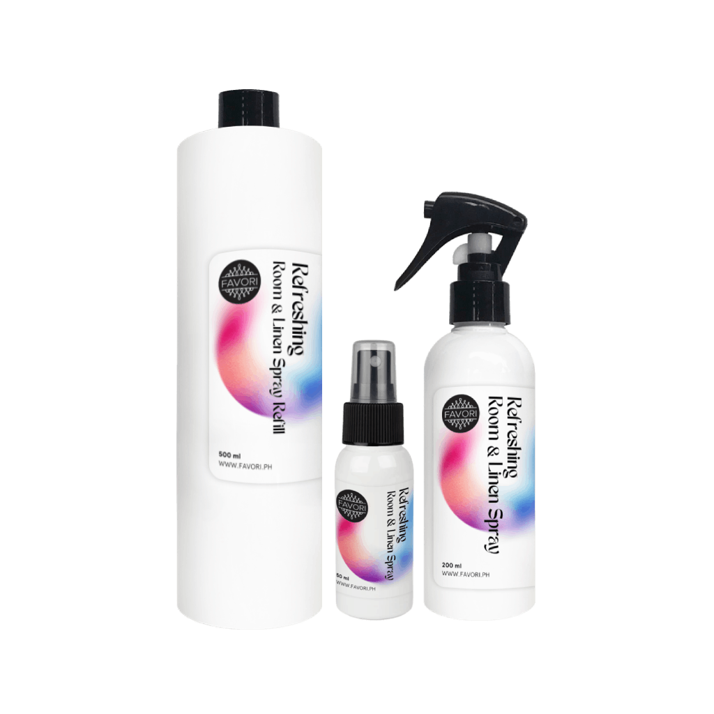 Three white bottles of FAVORI Scents Refreshing Room & Linen Air Spray (AS) with sleek black and colorful labels.