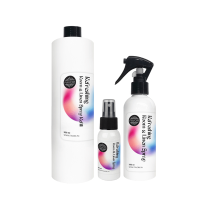 Three white bottles of FAVORI Scents Refreshing Room & Linen Air Spray (AS) with sleek black and colorful labels.