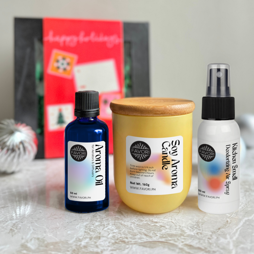 Three FAVORI Scents products—Aroma Oil, Soy Candle & Air Spray—are displayed on a marble surface.