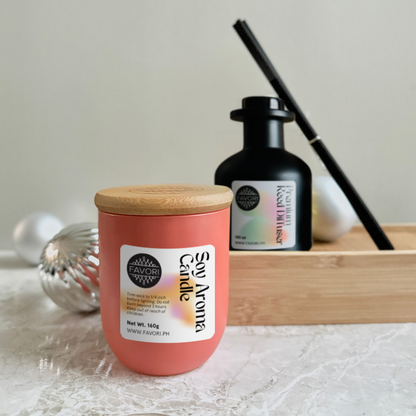 The FAVORI Scents Soy Aroma Candle (160g) and Premium Reed Diffuser (150ml) rest on a wooden tray.