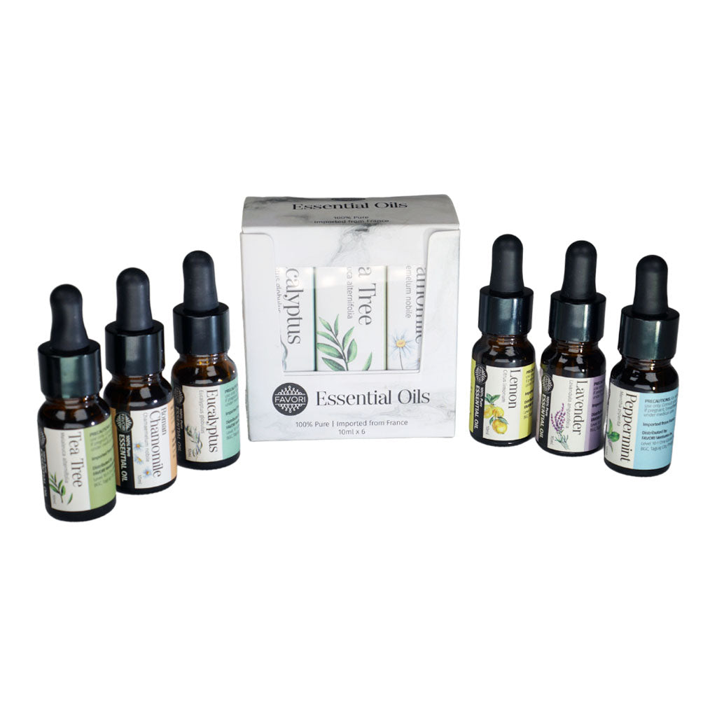 A collection of favori essential oil bottles with droppers displayed in front of their scents' packaging.