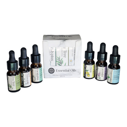 A collection of favori essential oil bottles with droppers displayed in front of their scents' packaging.