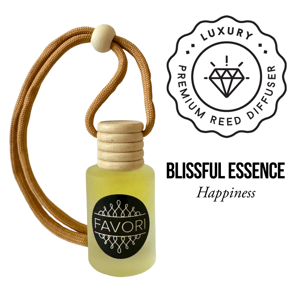 A small glass bottle labeled "FAVORI Scents" with a wooden cap and a knotted rope handle, containing a yellow liquid. Next to it is a circular logo with a diamond icon and text around it: "Luxury Premium Reed Diffuser." Below the logo is the text "Blissful Essence Hanging Aroma Diffuser (HAD)," promising lasting fragrance.