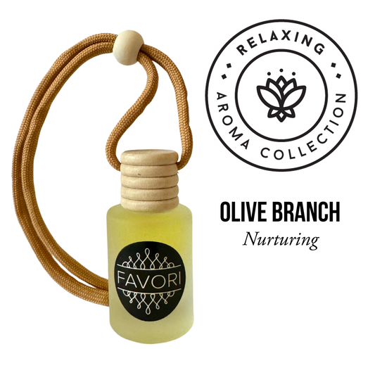 A small bottle of Olive Branch Hanging Aroma Diffuser (HAD) with a light yellow liquid inside, capped with a wooden lid and a tan string looped through it. To the right, a circular logo reads "Relaxing Aroma Collection" around an image of a lotus flower. Below, the text reads "FAVORI Scents." Perfect as a portable fragrance.